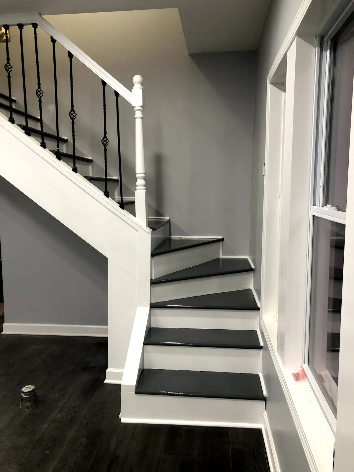The same stairway after drywall finishing, painting, and trim work were completed